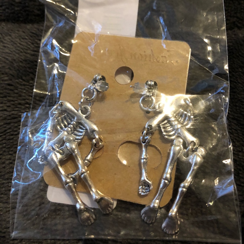 Skeleton metallic silver dangle earrings NWT